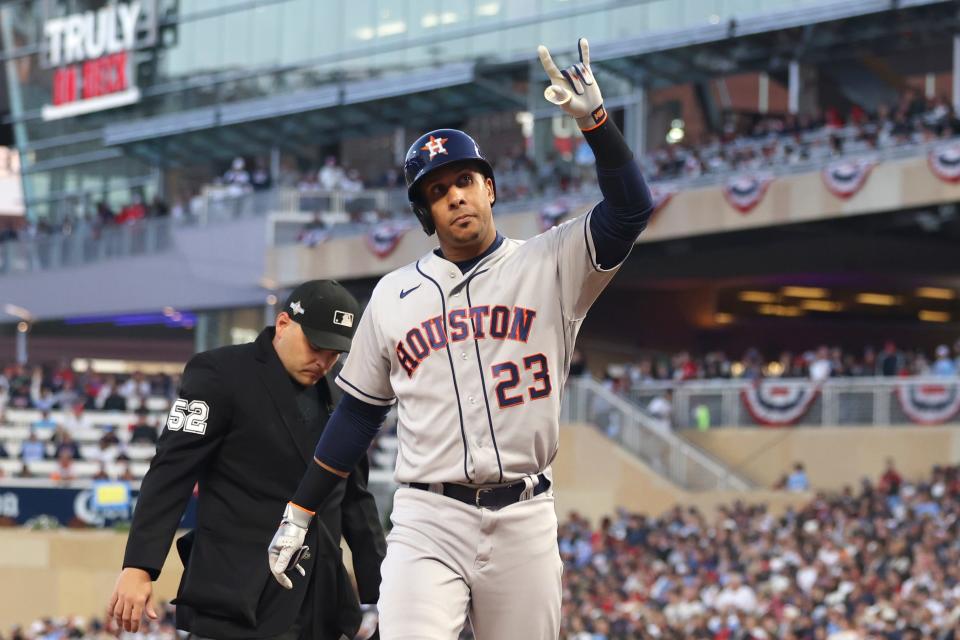 Game 3 at Minnesota: Astros' Michael Brantley acknowledges the fans as he approaches the dugout after a solo home run.