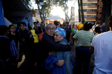 People react after an earthquake shook buildings in Mexico City, Mexico February 16, 2018. REUTERS/Edgard Garrido