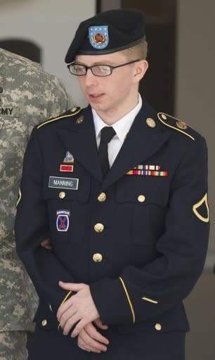 PFC Bradley Manning (R) is escorted by military police as he departs the courtroom at Fort Meade, Maryland on April 25. A US military judge ruled Thursday that WikiLeaks suspect Manning can be tried for "aiding the enemy" over allegedly leaking documents to the site -- a charge that carries a potential life sentence