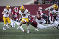 Minnesota running back Ky Thomas (8) is tackled by Indiana linebacker Cam Jones (4) in the second half during an NCAA college football game in Bloomington, Ind., Saturday, Nov. 20, 2021. (AP Photo/AJ Mast)