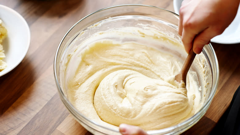 wooden spoon mixing bowl of batter