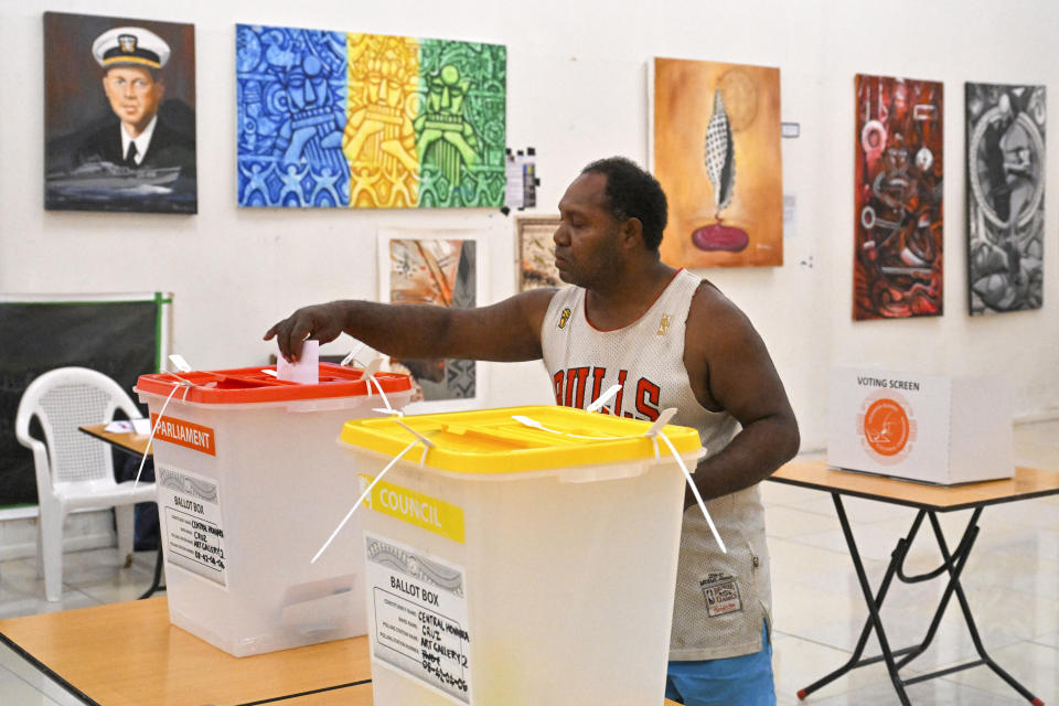 A voter casts his ballot during the Solomon Islands' elections in the capital Honiara, Wednesday, April 17, 2024. Voting has begun across the Solomon Islands in the South Pacific nation's first general election since the government switched diplomatic allegiances from Taiwan to Beijing and struck a secret security pact that has raised fears of the Chinese navy gaining a foothold in the region. (Mick Tsikas/AAP Image via AP)