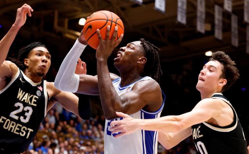 Duke’s Mark Mitchell (25) drives past Wake Forest’s Parker Friedrichsen (20) as he heads to the basket during the second half of Duke’s 77-69 victory over Wake Forest at Cameron Indoor Stadium in Durham, N.C., Monday, Feb. 12, 2024. Ethan Hyman/ehyman@newsobserver.com