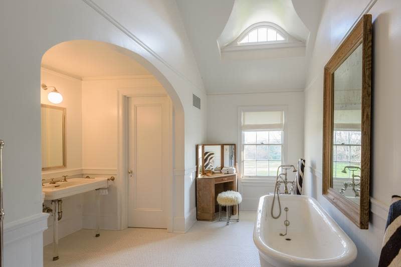 <p>There are also 12 bathrooms, including this one with a large soaker tub. <br>(Christie’s International Real Estate) </p>