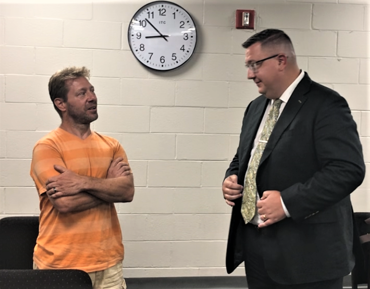 East High Street property owner Theodore Ochipinti (left) and attorney Kevin Diduch talk about a self-storage facility proposed for 214 E. High St. (Route 322) immediately after its narrow approval by the Glassboro Zoning Board on Thursday night. Ochipinti spoke against the project. Diduch represents the developer, Vision 214 High QOZB LLC, which promised residential neighbors the project will not be a detriment. PHOTO: July 20, 2023.