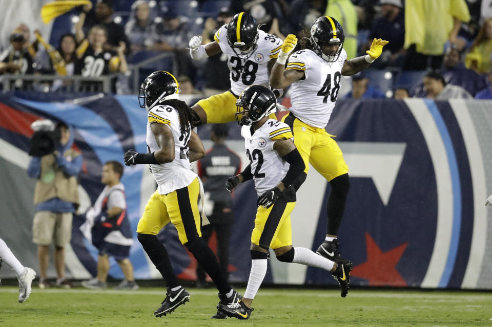 Pittsburgh Steelers defensive back Kam Kelly (38) and outside linebacker Bud Dupree (48) celebrate after Tennessee Titans quarterback Marcus Mariota was sacked in the end zone for a safety in the first half of a preseason NFL football game Sunday, Aug. 25, 2019, in Nashville, Tenn. (AP Photo/James Kenney)