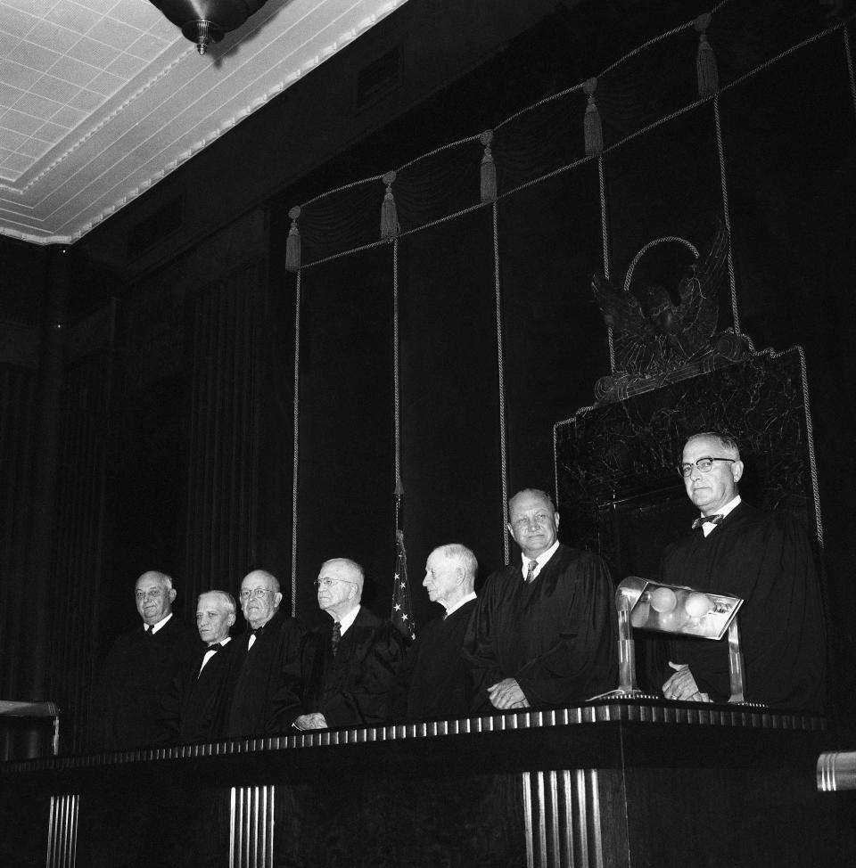 FILE - In this Aug. 4 1958 file photo shows jduges of the Eighth U.S. Circuit Court of Appeals, from left, Martin D. Van Oosterhout, Orange City, Iowa; Harvey M. Johnsen, Hastings, Neb.; John B. Sanborn, St. Paul, Minn.; Chief Justice Archibald K. Gardner, Huron, S.D.; Joseph W. Woodrough, Omaha, Neb.; Charles J. Vogel, Fargo, N.D., and Martin C. Matthes of St. Louis. In a special summer session, the court heard arguments in an appeal from a federal court order postponing the 2 ½ years integration in the Little Rock, Ark., Central high school. Five decades and $1 billion after an infamous racial episode made Little Rock a symbol of school segregation, the legal fight to ensure all of its children receive equal access to education has ended. (AP Photo/JMH, File)