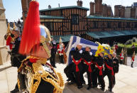 The coffin is carried up the steps of St George's Chapel during the procession of Britain Prince Philip's funeral at Windsor Castle, Windsor, England, Saturday April 17, 2021. Prince Philip died April 9 at the age of 99 after 73 years of marriage to Britain's Queen Elizabeth II. (Arthur Edwards/Pool via AP)