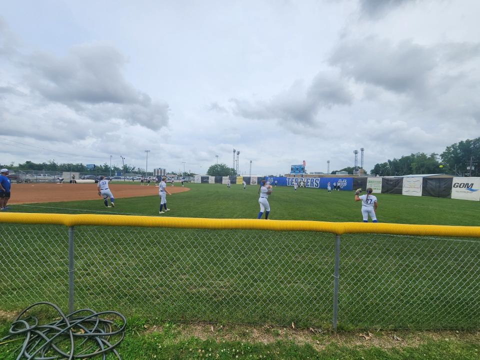 Vandebilt Catholic softball players warm up before Wednesday's game against Cabrini.