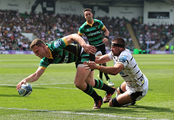 NORTHAMPTON, ENGLAND - MAY 11:  Fraser Dingwall of Northampton Saints scores their second try despite being held by Lewis Ludlow during the Gallagher Premiership Rugby match between Northampton Saints and Gloucester Rugby at cinch Stadium at Franklin's Gardens on May 11, 2024 in Northampton, England. (Photo by David Rogers/Getty Images)