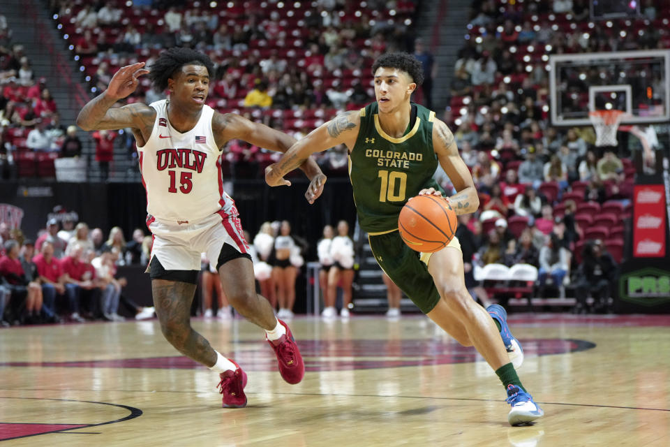 Colorado State guard Nique Clifford (10) drives the ball against UNLV guard Luis Rodriguez (15) during the second half of an NCAA college basketball game Saturday, Feb. 24, 2024, in Las Vegas. (AP Photo/Lucas Peltier)