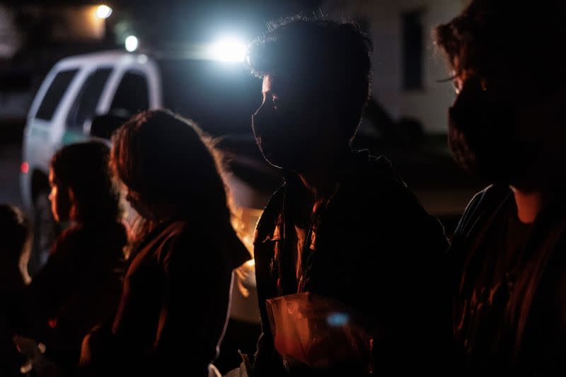 Asylum-seeking migrants cross the Rio Grande river in Roma