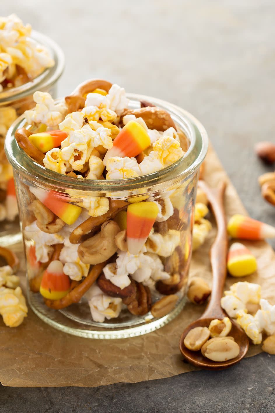 <p>For a quick and easy Halloween treat that guests can snack on all night long, combine heart-healthy nuts and unbuttered popcorn with a few more decadent mini snacks (like pretzels and candy corn) in a bag or container.</p>