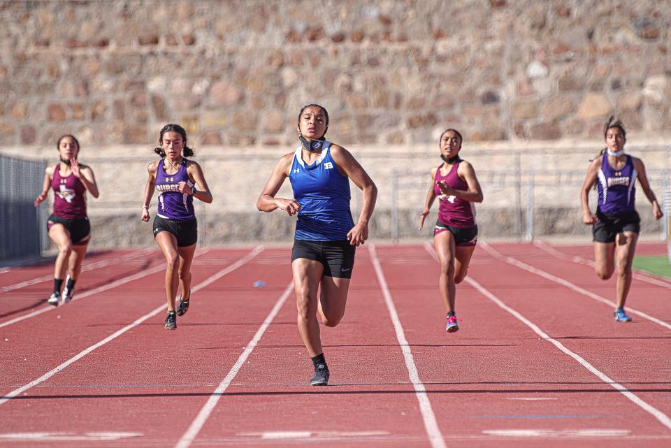 Bowie's Citlaly Rodriguez leads, running toward the finish line in the 200 meter dash. El Paso District 1-5A schools competed in a track and field meet at Austin High School on March 31, 2021.