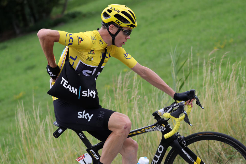 Chris Froome carrying a musette