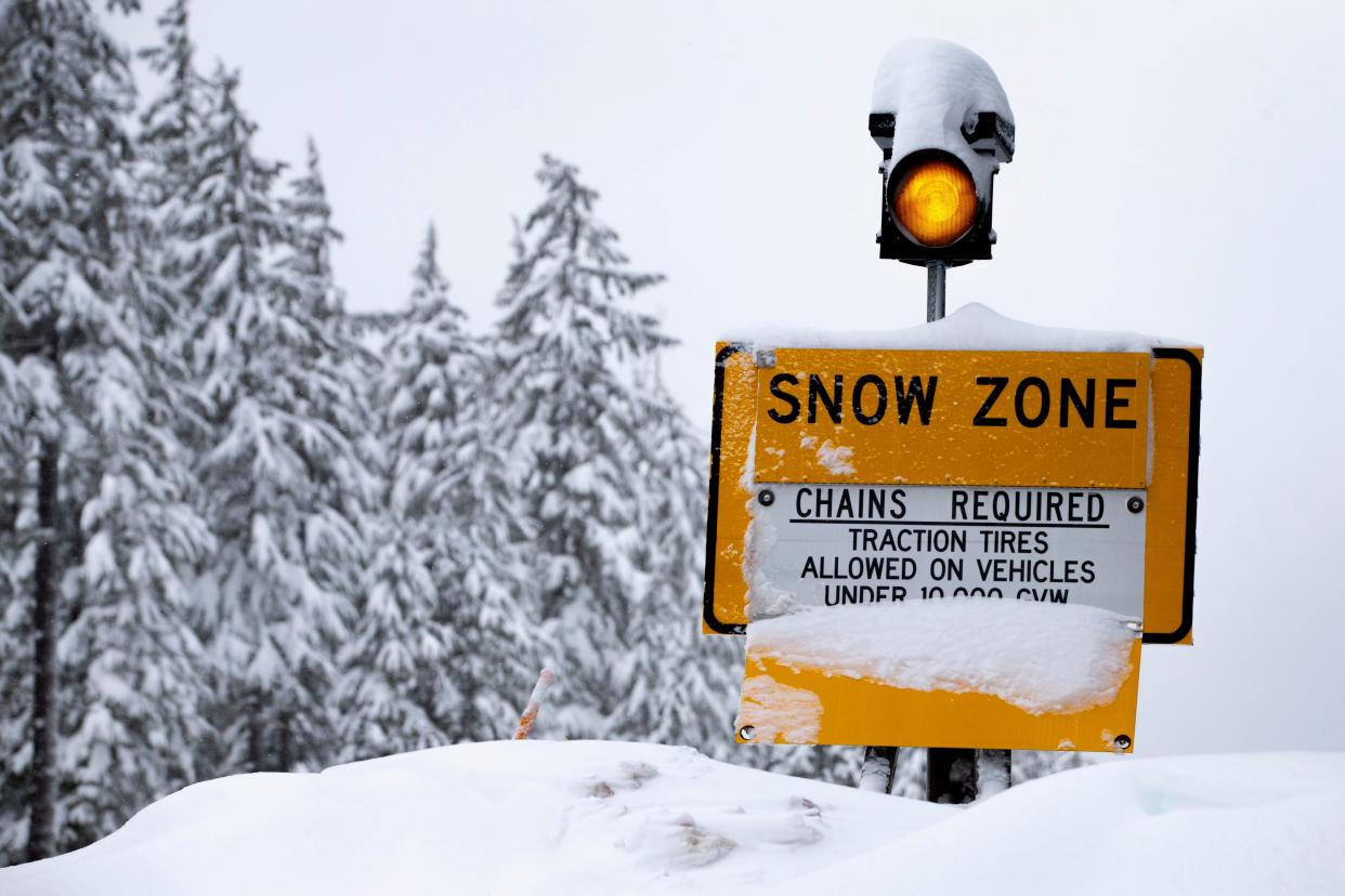 A warning sign advises of chain requirements on Highway 58 near Willamette Pass Jan. 10.