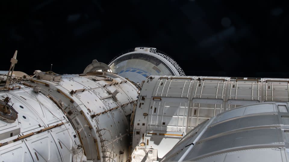 The Boeing Starliner spacecraft (far back) is seen docked with the International Space Station's Harmony module on June 14. - NASA