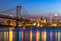 <p>The Benjamin Franklin Bridge heading into the bright lights of Philadelphia cast some gorgeous reflections on the Delaware River. </p>