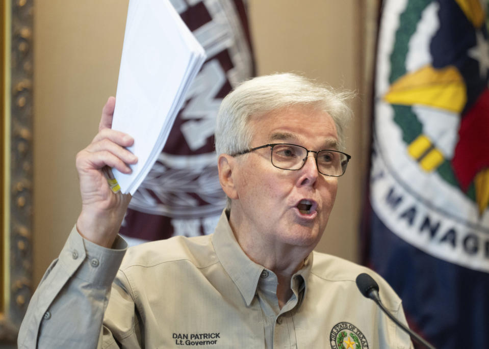 Texas Lt. Gov Dan Patrick, currently serving as acting Governor, holds up a packet his office presented media detailing conversation timelines and statements by President Joe Biden and Harris County Judge Lina Hidalgo during a press conference to update recover efforts after Hurricane Beryl at Galleria Tower II, Thursday, July 11, 2024, in Houston. Patrick assumed the role while Greg Abbott is on a work trip in Asia. (Jason Fochtman/Houston Chronicle via AP)