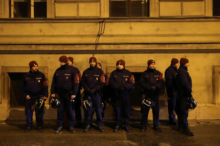 Police stand guard during a protest against a proposed new labor law, billed as the "slave law", in front of the parliament building in Budapest, Hungary December 21, 2018. REUTERS/Marko Djurica