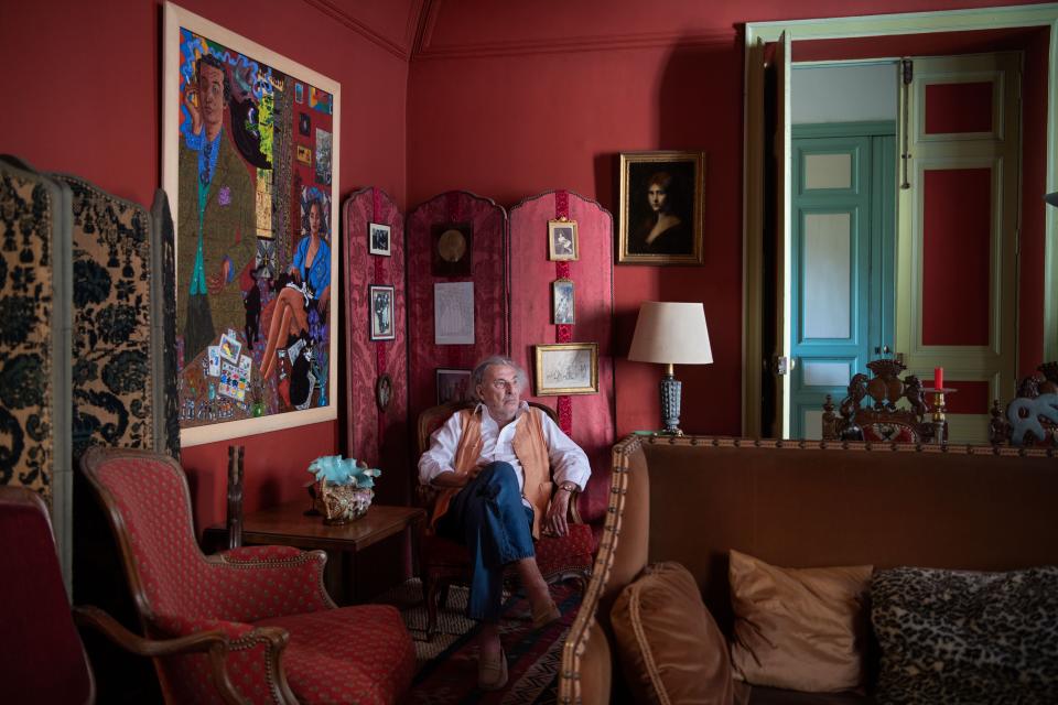 The artist in the main salon. On left wall, Portrait of De Rougemont and his wife by Eduardo Arroyo.