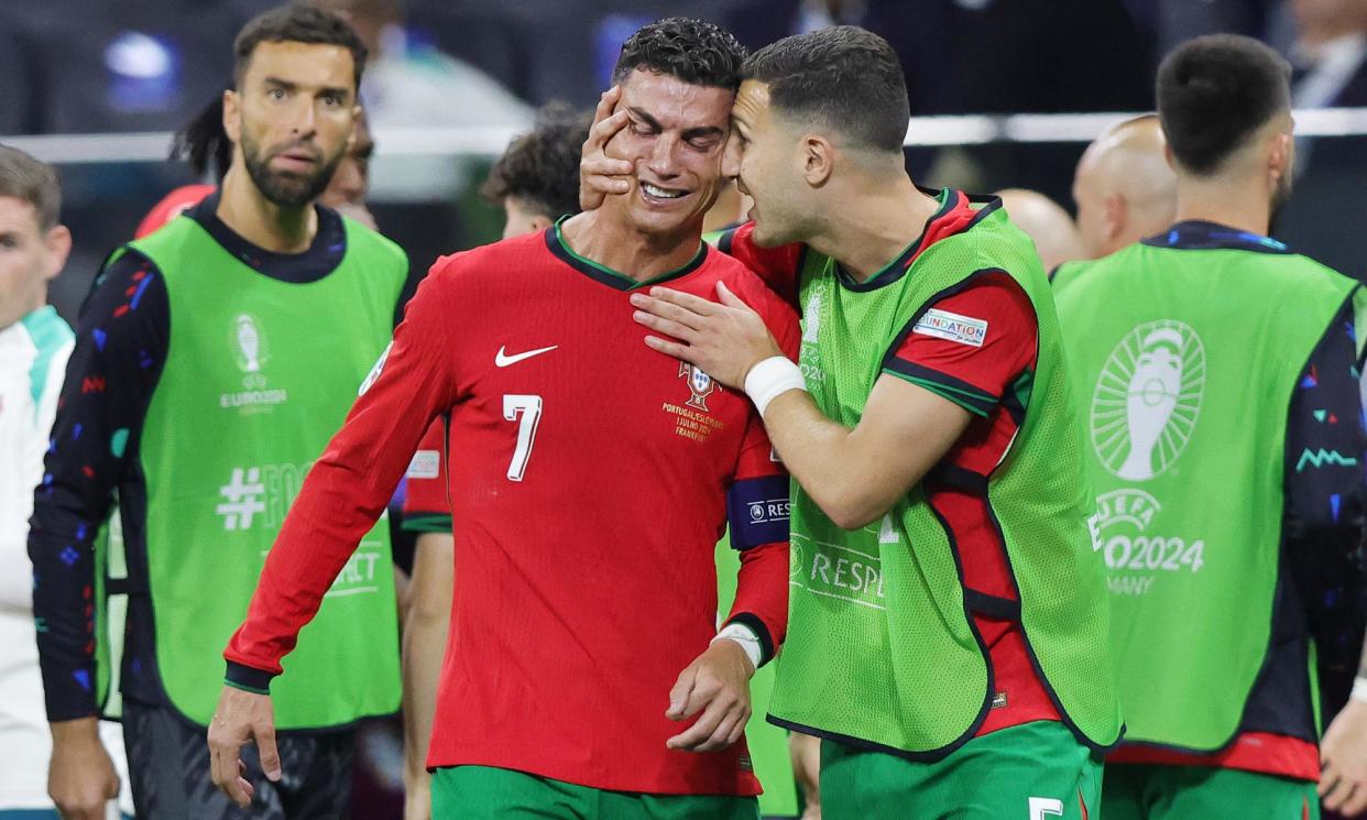 <span>Cristiano Ronaldo cries after missing an extra-time penalty against Slovenia. He went on to score in the shootout.</span><span>Photograph: Ralf Ibing/firo sportphoto/Getty Images</span>