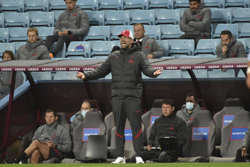 Liverpool's manager Jurgen Klopp shouts out from the touchline during the English Premier League soccer match between Aston Villa and Liverpool at the Villa Park stadium in Birmingham, England, Sunday, Oct. 4, 2020. (AP Photo/Rui Vieira, Pool)