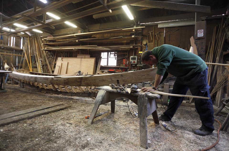 Lorenzo Della Toffola works on a gondola in the San Trovaso boatyard known as a