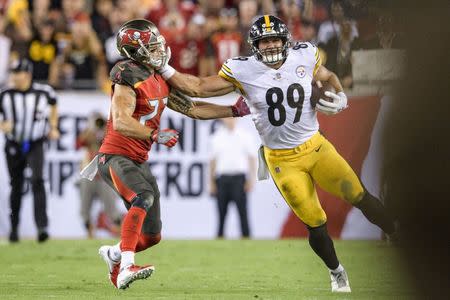 Sep 24, 2018; Tampa, FL, USA; Pittsburgh Steelers tight end Vance McDonald (89) stiff arms Tampa Bay Buccaneers safety Chris Conte (23) during the first half at Raymond James Stadium. Mandatory Credit: Douglas DeFelice-USA TODAY Sports