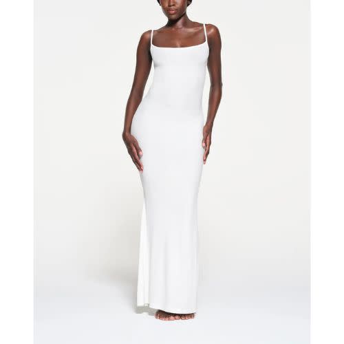 model wearing white maxi slip dress