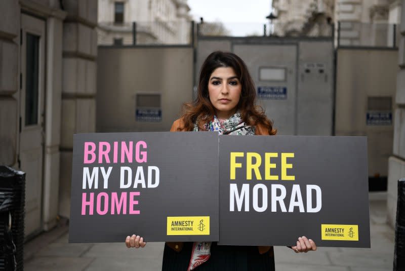 Roxanne Tahbaz protests outside of the British Foreign Office for the release of her father Morad Tahbaz in 2020. On Monday a prisoner swap to free Tahbaz and four other Americans held by Iran was set to be completed. File Photo by Andy Rain/EPA-EFE