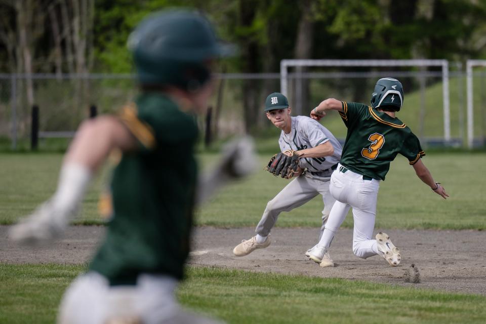 Wachusett's Kyle Frederick tags out Tantasqua's C.J. Harrell at secon, but cant turn the double play as Colm McGrath races to first.