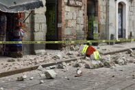 Security tape alert people of a building damaged by an earthquake in Oaxaca, Mexico,Tuesday, June 23, 2020. The earthquake was centered near the resort of Huatulco, in the southern state of Oaxaca. (AP Photo/Luis Alberto Cruz Hernandez)