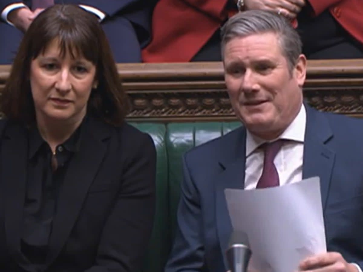 Shadow chancellor Rachel Reeves sits beside Labour leader Keir Starmer (PA)