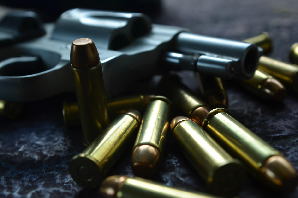 Close up of gun and bullets. (Getty Images)