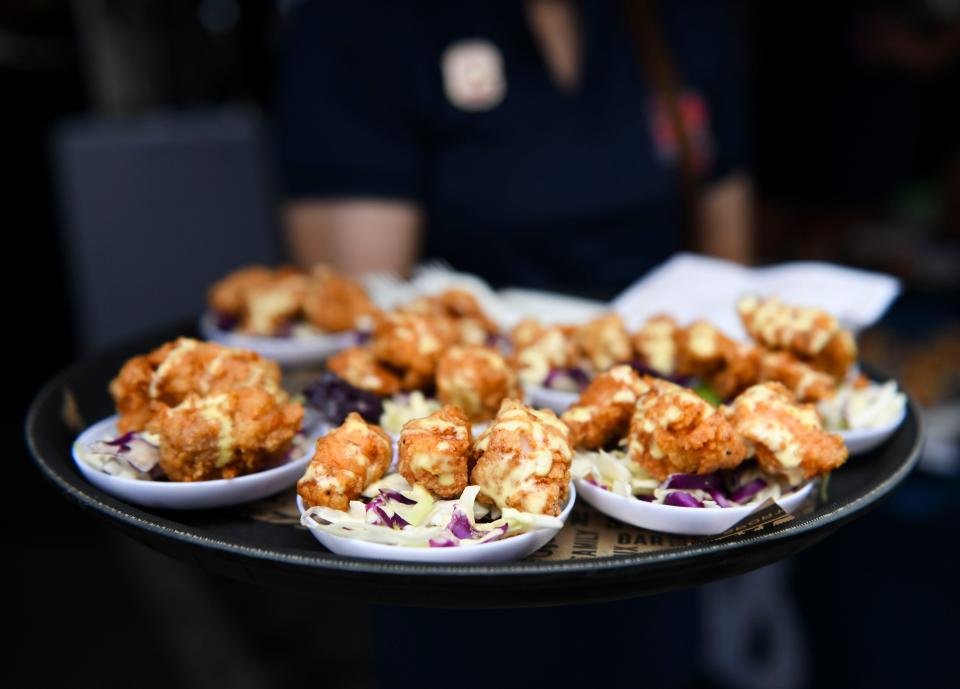 A fried alligator dish is served during a preview for the new Walk-On's Sports Bistreaux at 403 College Ave., on Wednesday, July 13, 2022. 