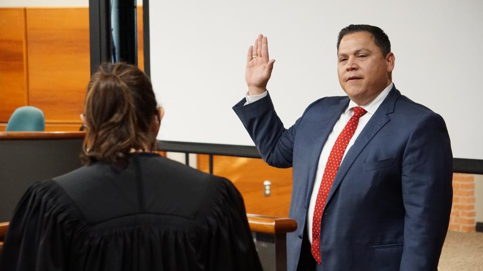 Gabe Guerra, CEO and president of Kleberg Bank, is swor-in to the port commission by Nueces County Judge Barbara Canales on Thursday.