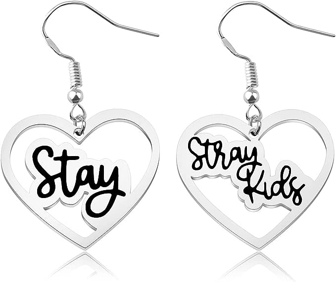 silver heart-shaped earrings that read "Stray Kids"