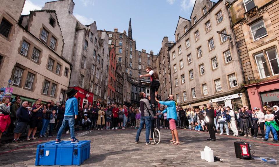 A street artist performs during a pre-pandemic Edinburgh fringe festival. The city is normally crowded throughout the summer.