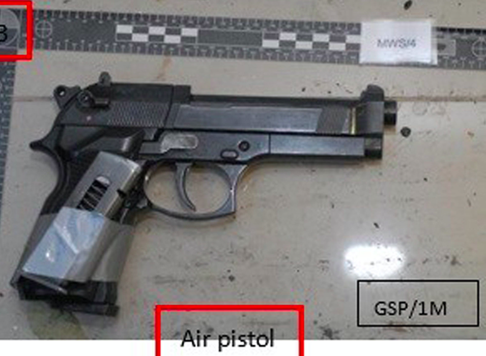 <em>An imitation handgun with an empty magazine strapped to it that was also found stashed in the car (PA)</em>