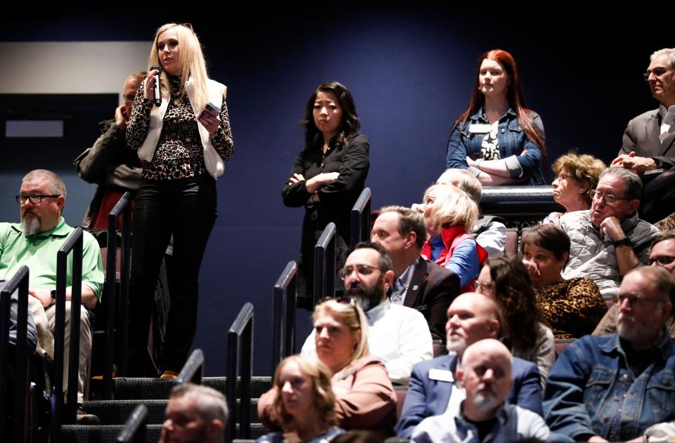 Paige M. Grisham, with the Missouri State University athletics department, asks a question to a finalist for the university president job, Richard "Biff" Williams, in the Plaster Student Union auditorium on Thursday, Feb. 15, 2024.