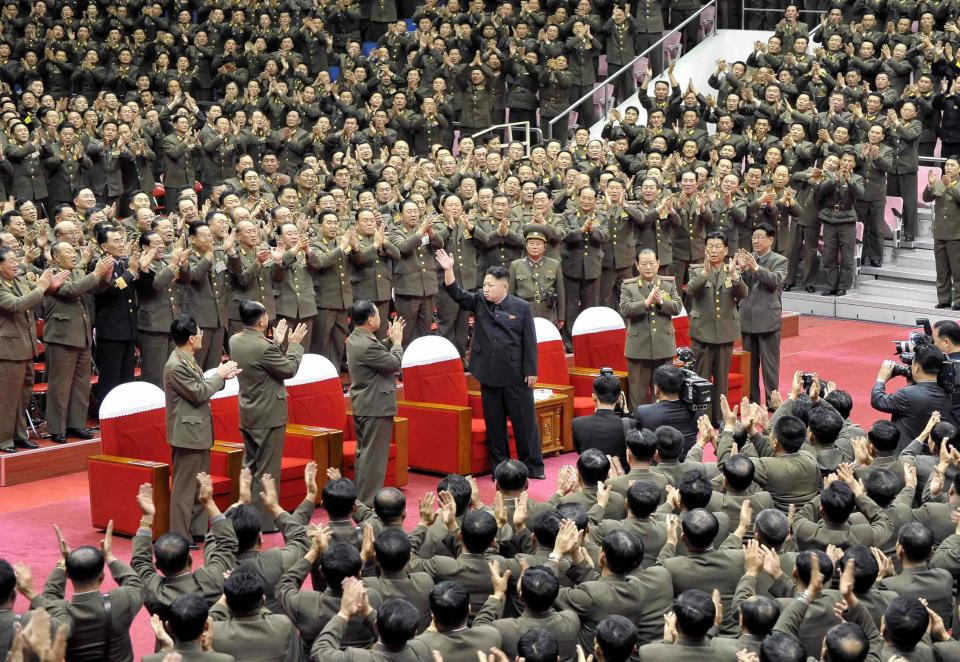 North Korean leader Kim Jong Un waves during a performance by the State Merited Chorus in this undated photo released by North Korea's Korean Central News Agency (KCNA) in Pyongyang November 22, 2013. REUTERS/KCNA/Handout via Reuters (NORTH KOREA - Tags: POLITICS) ATTENTION EDITORS - THIS PICTURE WAS PROVIDED BY A THIRD PARTY. REUTERS IS UNABLE TO INDEPENDENTLY VERIFY THE AUTHENTICITY, CONTENT, LOCATION OR DATE OF THIS IMAGE. FOR EDITORIAL USE ONLY. NOT FOR SALE FOR MARKETING OR ADVERTISING CAMPAIGNS. THIS PICTURE IS DISTRIBUTED EXACTLY AS RECEIVED BY REUTERS, AS A SERVICE TO CLIENTS. NO THIRD PARTY SALES. NOT FOR USE BY REUTERS THIRD PARTY DISTRIBUTORS. SOUTH KOREA OUT. NO COMMERCIAL OR EDITORIAL SALES IN SOUTH KOREA