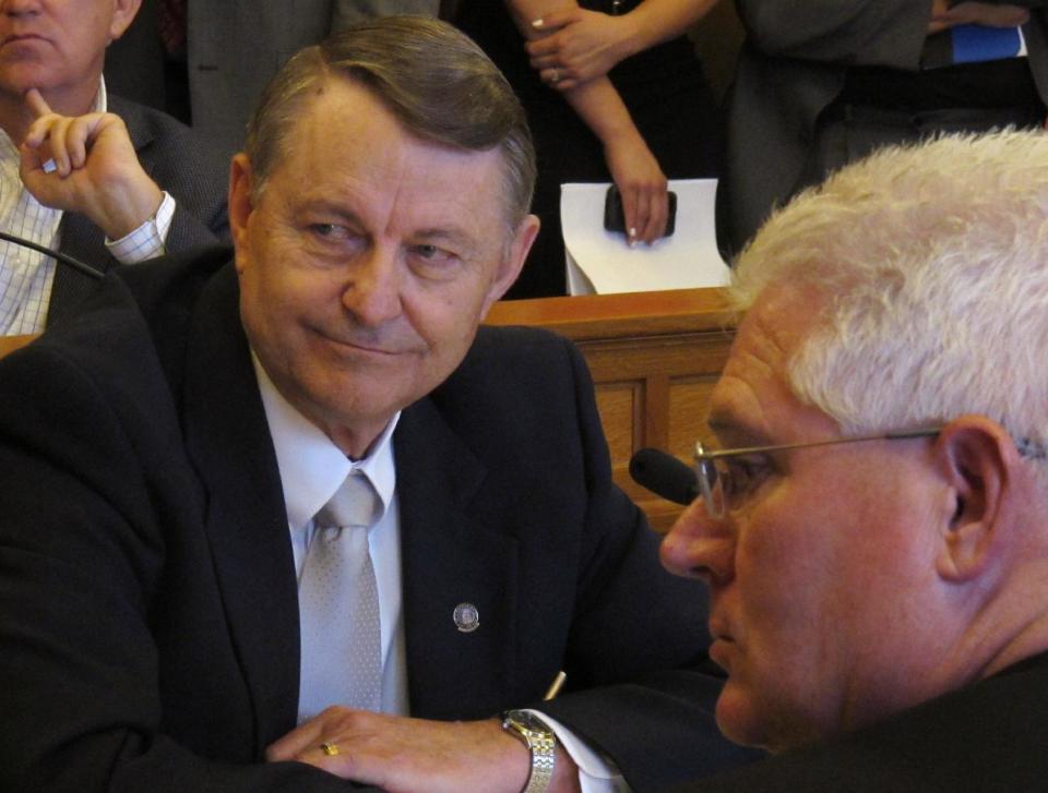 Kansas state Rep. Richard Carlson, a St. Marys Republican, the House's lead negotiator on tax issues, follows discussions about pushing for less aggressive income tax cuts than ones previously approved by legislators, Tuesday, May 15, 2012, at the Statehouse in Topeka, Kan. To his right is Sen. Pat Apple, a Louisburg Republican. (AP Photo/John Hanna)