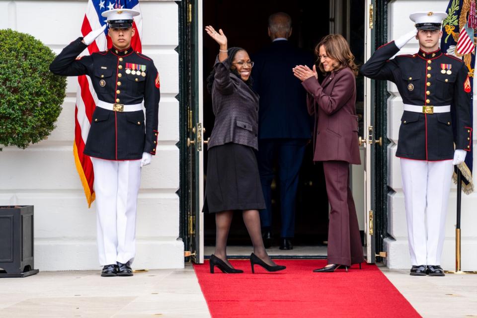 Vice President Kamala Harris applauds as Judge Ketanji Brown Jackson waves and President Biden walks into the White House