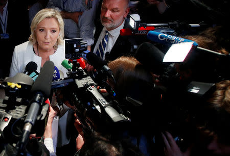 French far-right National Rally (Rassemblement National) party leader Marine Le Pen talks to the media after the first results in Paris, France, May 26, 2019. REUTERS/Charles Platiau