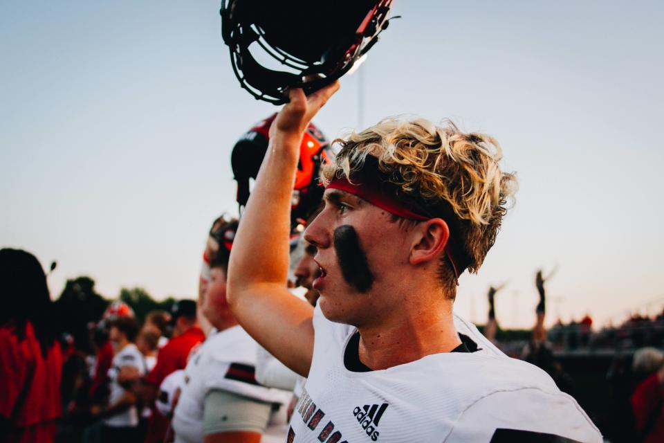 Southern Boone player raises his helmet during kickoff at a game against the California Pintos on Sept. 9, 2022 at Southern Boone High School in Ashland.