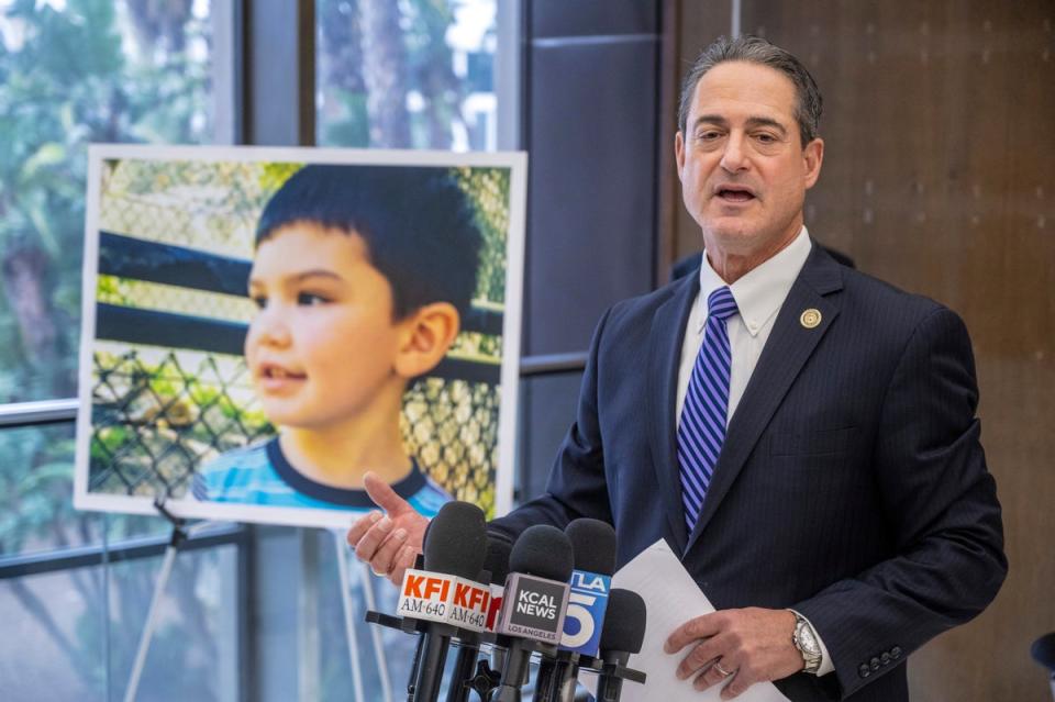 Orange County District Attorney Todd Spitzer, pictured with a portrait of Aiden Leos, praised Eriz’s maximum sentence on Friday (AP)