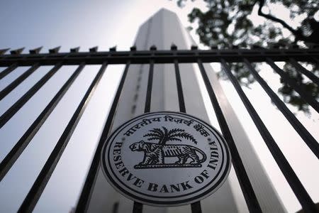 The Reserve Bank of India (RBI) seal is pictured on a gate outside the RBI headquarters in Mumbai October 29, 2013. REUTERS/Danish Siddiqui/Files