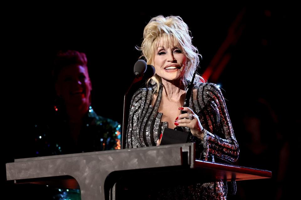 Dolly Parton, shown here in 2022 at her Rock and Roll Hall of Fame induction ceremony, is one of a few celebrities who have collaborated with James Patterson on fiction. Patterson says his next will be with a well-loved actor.