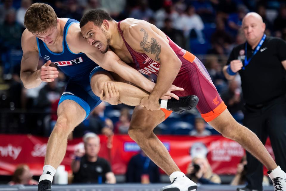 Aaron Brooks (right) wrestles Connor Mirasola in a 86 kilogram challenge round quarterfinal bout during the U.S. Olympic Team Trials at the Bryce Jordan Center April 19, 2024, in State College.